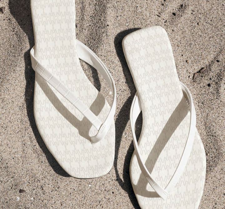 Patterned flip-flops on sand