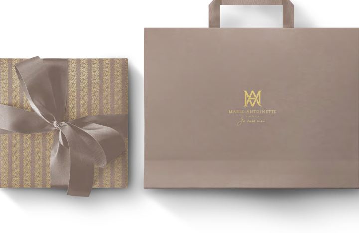 Gift box and shopping bag with gold monogram