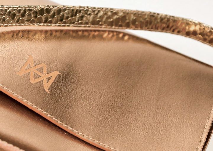 Rose-gold metallic pouch with monogram